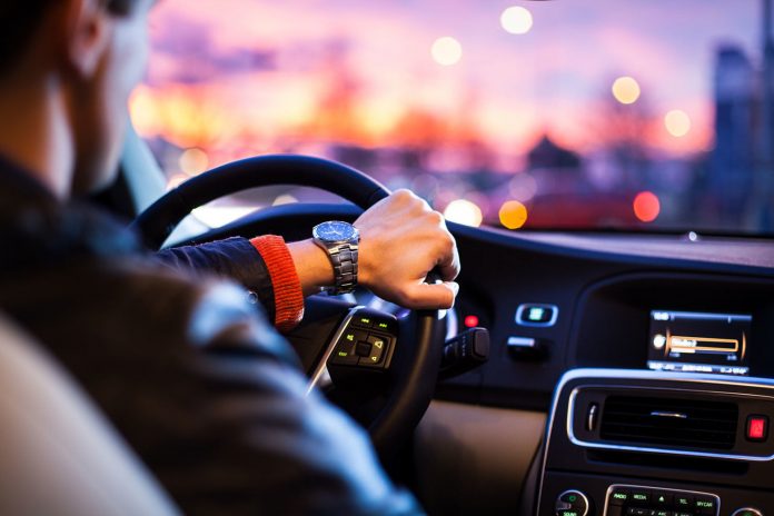 man-driving-in-car-in-the-city-ride-share-uber-lyft-getaround-zipcar-3 limo service