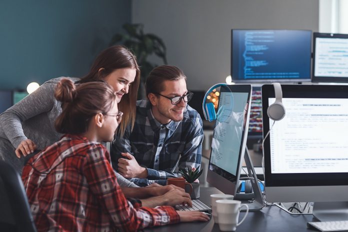 Team of programmers working in office