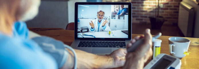 Senior Man consulting with his doctor online virtual care management